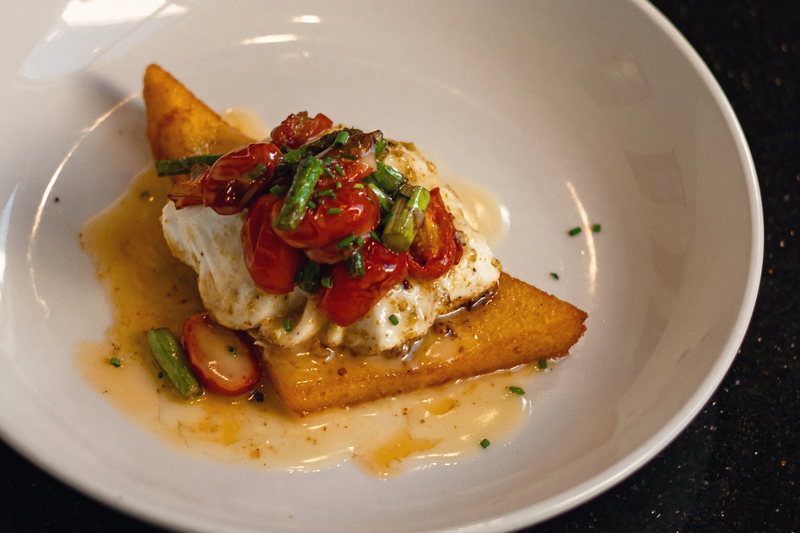 Blistered tomatoes and burrata over creamy polenta.